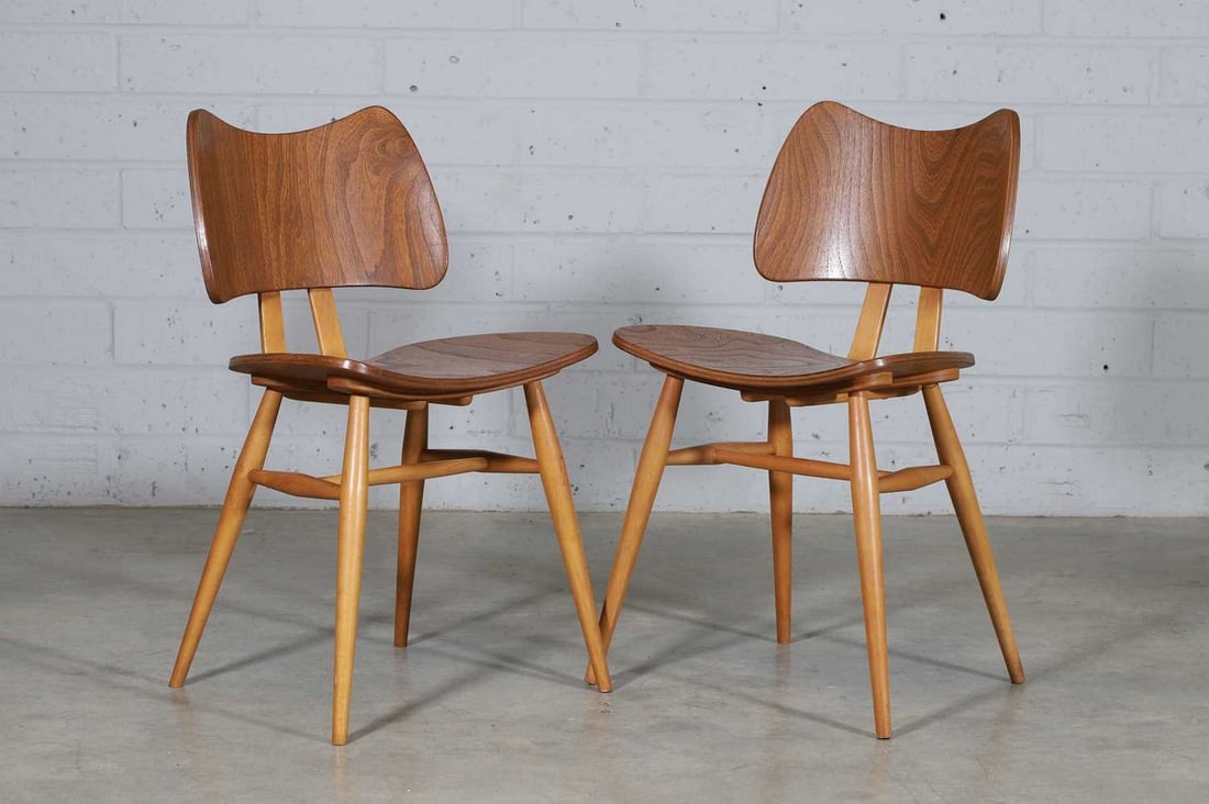 Lucian Ercolani (Italian, 1888-1976),: Lucian Ercolani (Italian, 1888-1976), a pair of Ercol 'Model 401 Butterfly' chairs, c.1958, also known as the 'Preformed chair', stamped 'Reg. Des. No 888,150', 44cm wide 45cm deep 75cm high, seat 43c