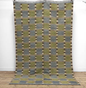A kilim flat-weave wool rug in the style of Barbro Nilsson,: A kilim flat-weave wool rug in the style of Barbro Nilsson, of recent manufacture, decorated with checks in tones of blue, green, black and white, 267 x 170cm