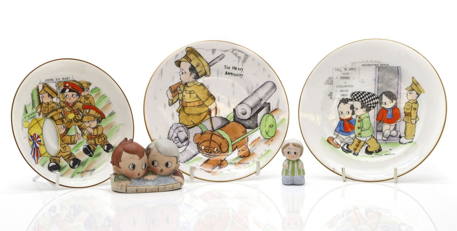 A Schafer and Vater porcelain figure group: A Schafer and Vater porcelain figure group early 20th century, German, of a girl and boy, 7cm wide together with a bisque porcelain figure, of a young girl, 4.5cm high and three Chloe Preston Fist Wor