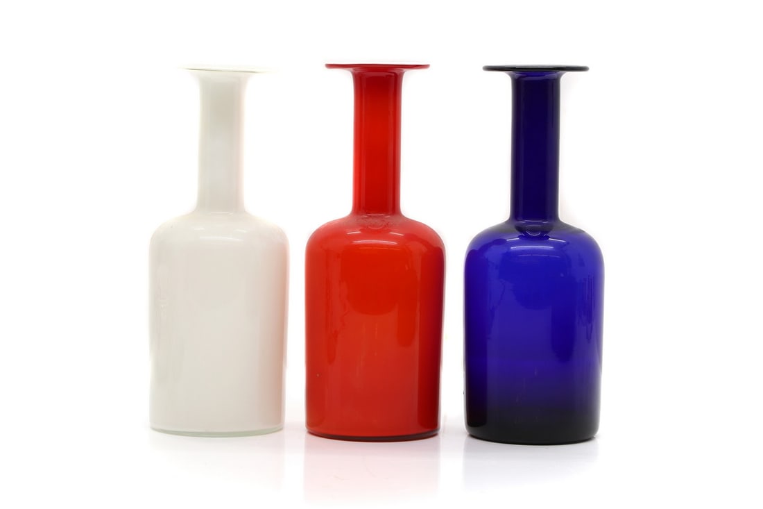 Three Holmegaard 'Gulvvase' vases,: Three Holmegaard 'Gulvvase' vases, 20th century, designed by Otto Brauer for Holmegaard, of shouldered form, in red, blue and white, 10cm diameter 25.5cm high, (3) Condition Report: With some marks an