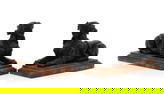 A pair of black basalt figures