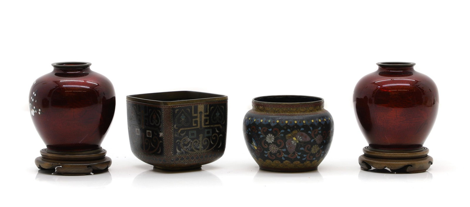 A pair of Japanese cloisonné jars,: A pair of Japanese cloisonné jars, 20th century, of globular form, enamelled with a blossoming prunus tree against a red ground, 9cm high, wood stands, and two Japanese cloisonné incense bur