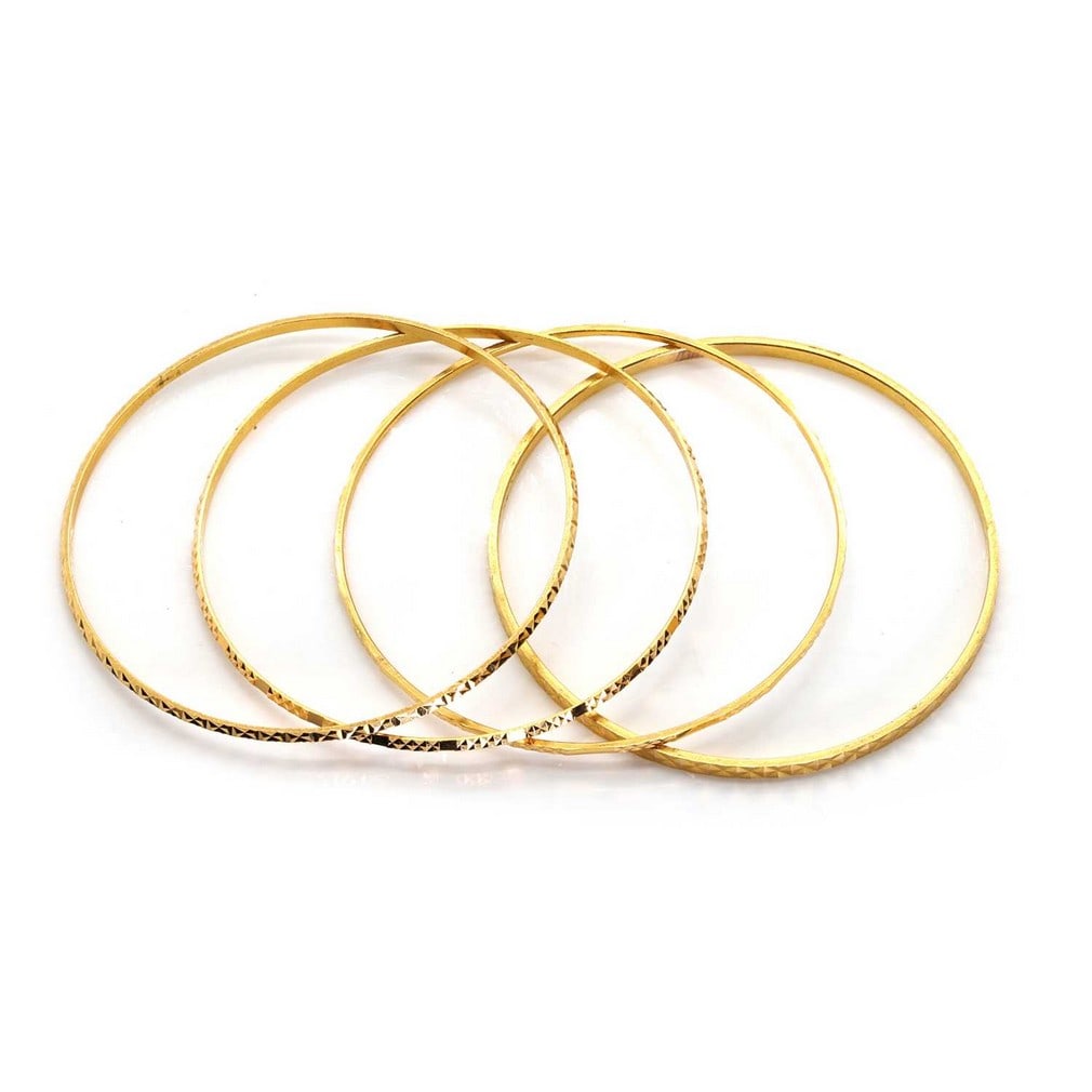 A group of four high carat yellow gold bangles,: A group of four high carat yellow gold bangles, comprising a faceted flat profile bangle, two faceted D profile bangles, all stamped 21, and a thin faceted square profile bangle, all round in shape wi