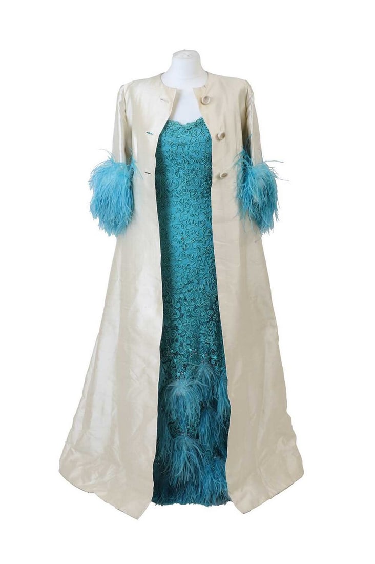 A Norman Hartnell silk coat and occasion dress,: A Norman Hartnell silk coat and occasion dress, c.1960s, the coat exterior in cream shangtung silk with turquoise ostrich feather trim half sleeves, the lining in turquoise silk, and a matching turquo