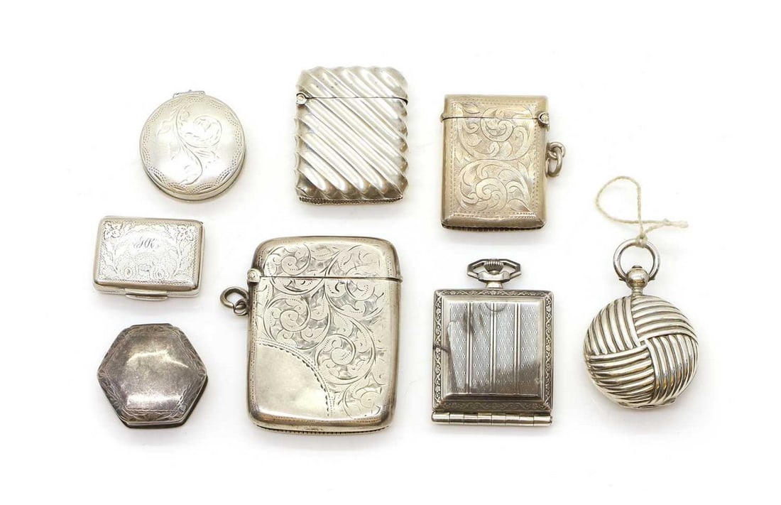 A collection of silver vesta and pill boxes,: A collection of silver vesta and pill boxes, to include, a George III silver and silver gilt vinaigrette, by Postans & Tye (William Postans & George Tye), Birmingham 1819, 2.8cm wide, a pocket watch,
