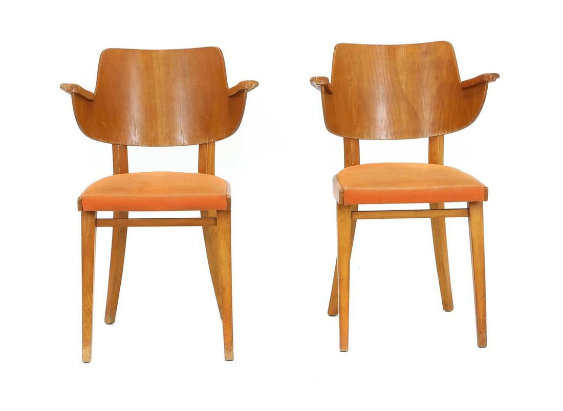 A pair of Thonet elbow chairs: A pair of Thonet elbow chairs c.1950s, possibly designed by Michael Thonet or Oswald Haerdtl, the curved wood back with two integrated armrests, rising from a horseshoe shaped seat upholstered in oran