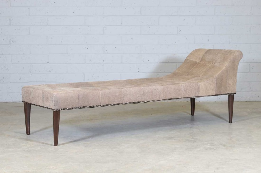 A Fendi daybed,: A Fendi daybed, of recent manufacture, the vinyl button-upholstered bed supported on teak tapering legs, with repeated 'Fendi' branded text to the underside upholstery, 63cm wide 202cm long 69.5cm hig