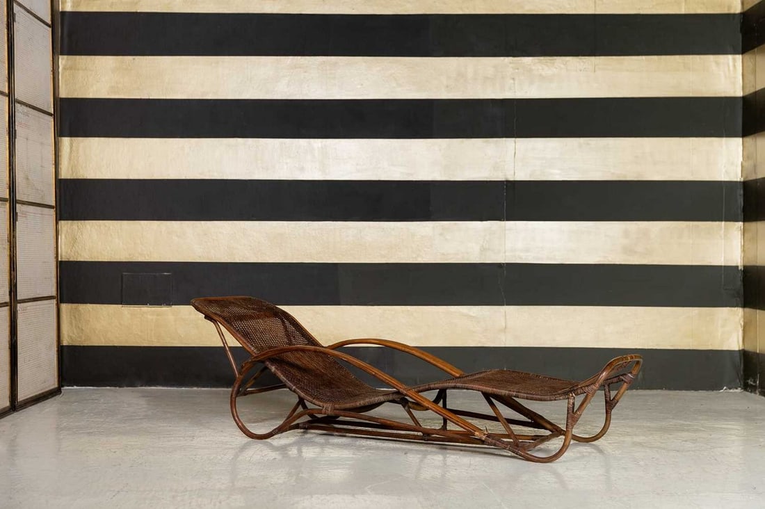 A rattan lounger or chaise longue,: A rattan lounger or chaise longue, 20th century, Indonesian, 190cm long 67cm wide 59cm high