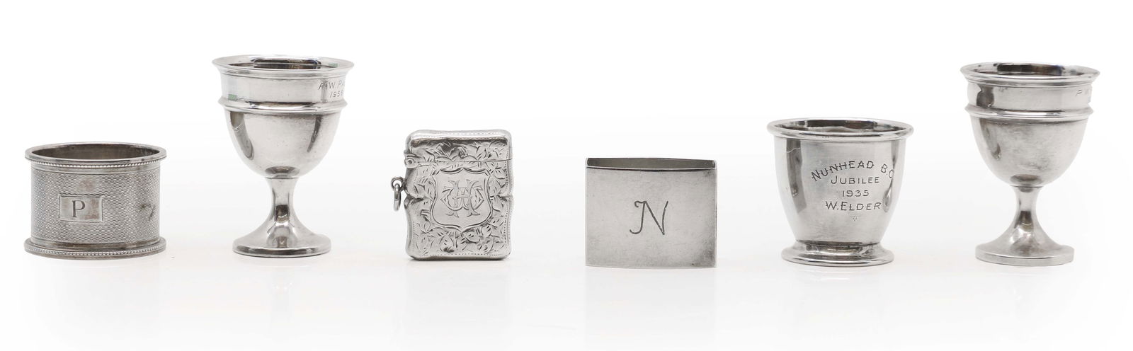 A collection of silver items: A collection of silver items to include two napkin rings largest 4.5cm wide and a pair of egg cups, by S Blanckensee & Son Ltd, Chester 1935, in the form of goblets, 6.2cm high, together with one othe