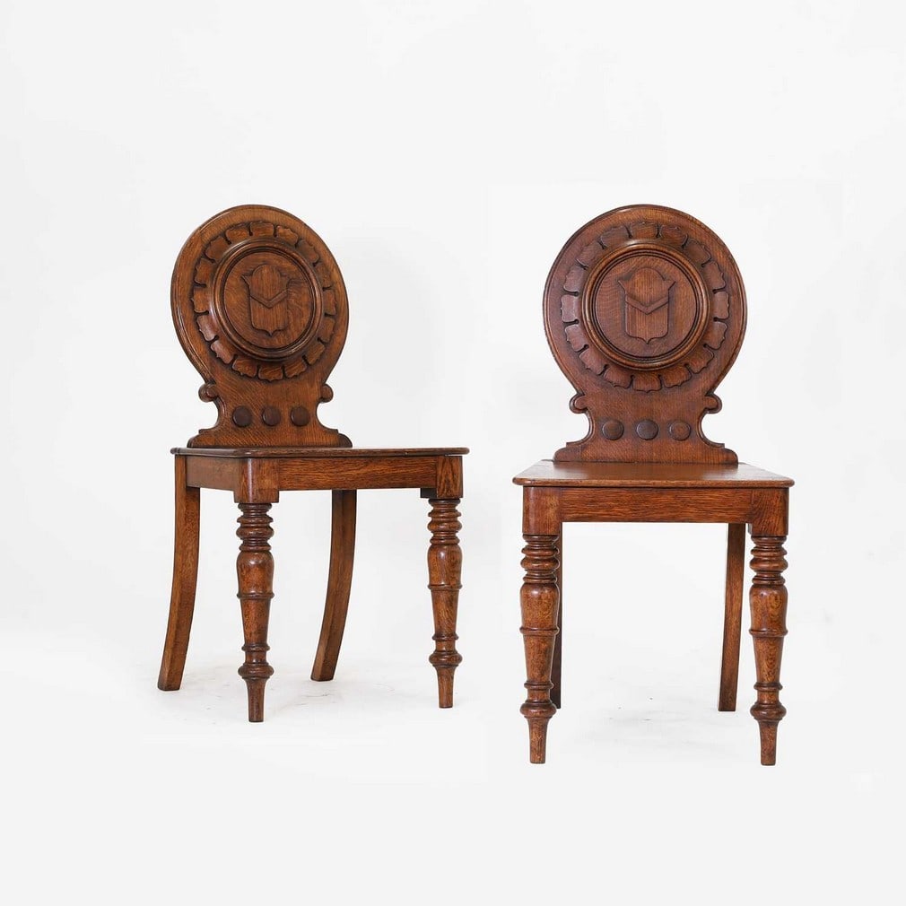 A pair of Victorian oak hall chairs, (1 of 4)