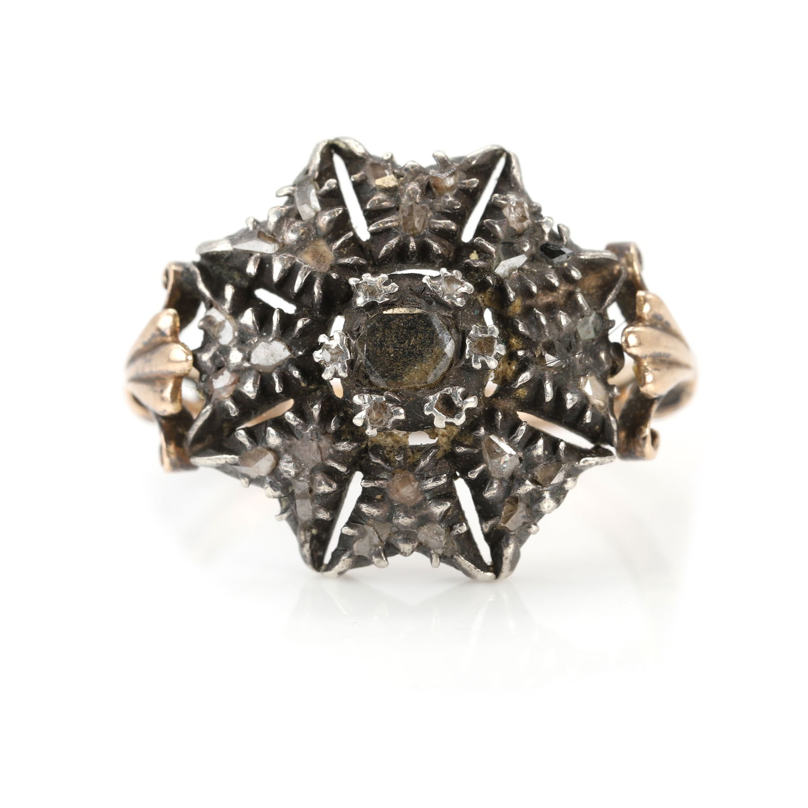 An antique Portuguese diamond cluster ring,: An antique Portuguese diamond cluster ring, of starburst design, with a cluster of rose cut diamonds set in silver on gold, to scrolling shoulders into a grooved band. Portuguese hallmark for gold and