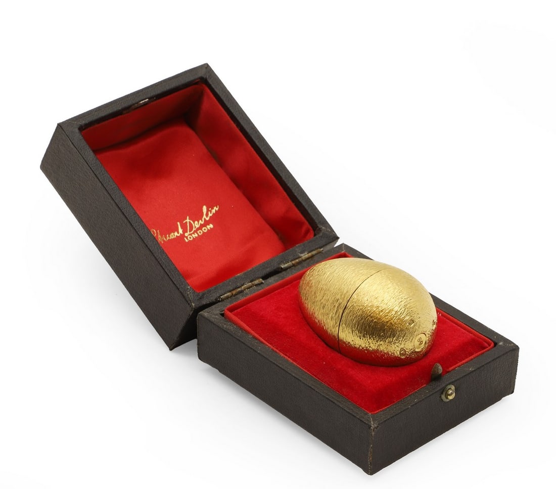 A Stuart Devlin silver and silver gilt commemorative egg,: A Stuart Devlin silver and silver gilt commemorative egg, London 1981, commemorated for the wedding of HRH Prince Charles and Lady Diana Spencer, 29th July 1981, numbered 69, in original box and with