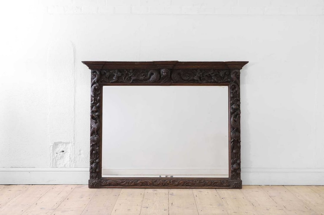 A carved oak overmantel mirror, (1 of 5)