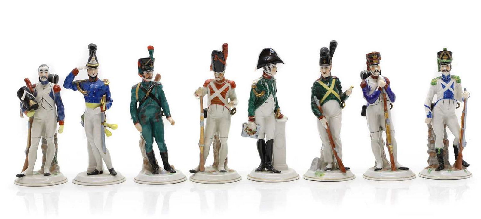 A group of Capodimonte porcelain figures: A group of Capodimonte porcelain figures of soldiers and guards, painted marks, and impressed numbers, 19cm high (8) Condition Report: Two figures with losses to the swords and one with losses to the