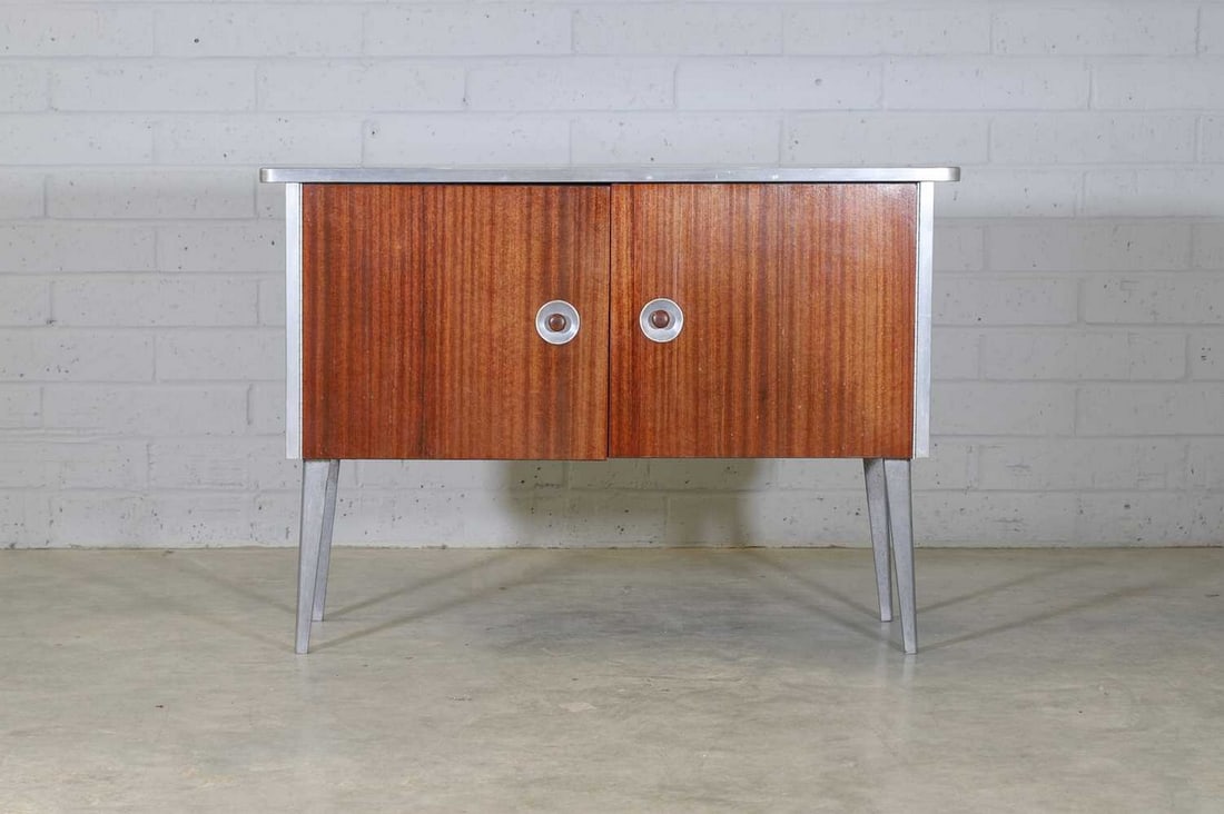 Ernest Race (1913-1964),: Ernest Race (1913-1964), a 'BD1' sideboard, designed 1945-46 for Race Furniture Ltd., of aluminium and mahogany-veneered 'Holoplast' panels, the cupboard doors with circular recessed handles, raised o