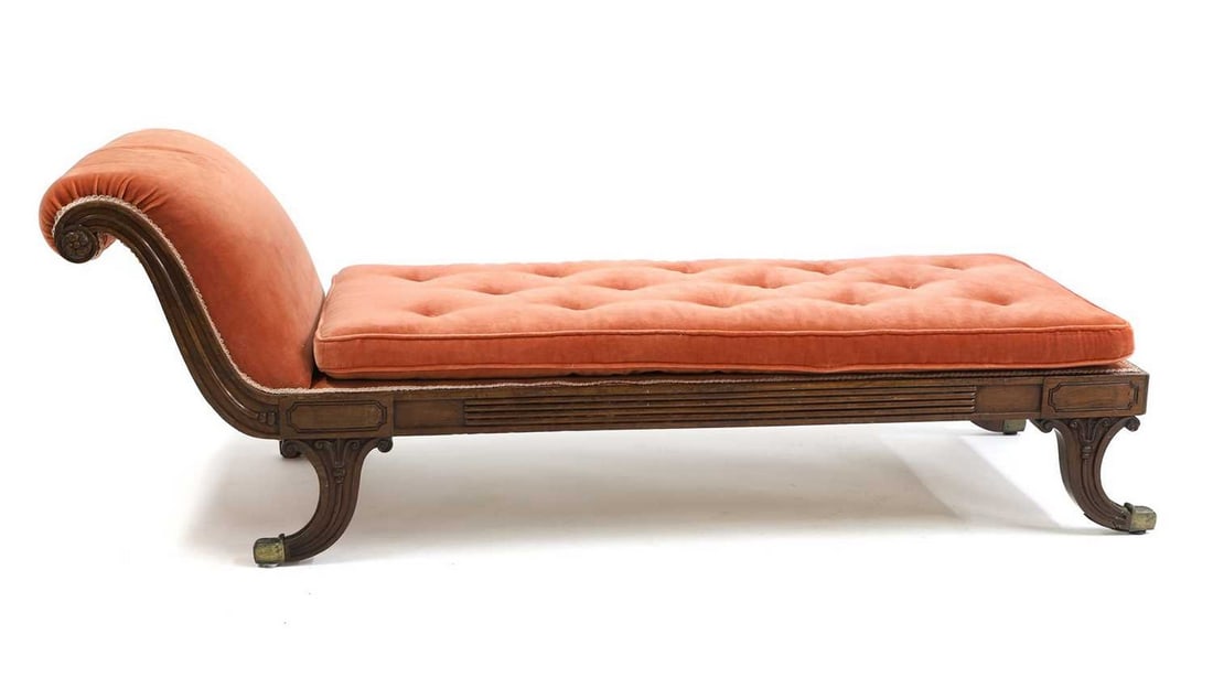 A Regency mahogany chaise longue,: A Regency mahogany chaise longue, in the manner of Gillows, with carved details and a seat cushion on swept legs and brass sabots, 190cm wide 67cm deep 70cm high, seat 45cm Condition Report: Used. Wit