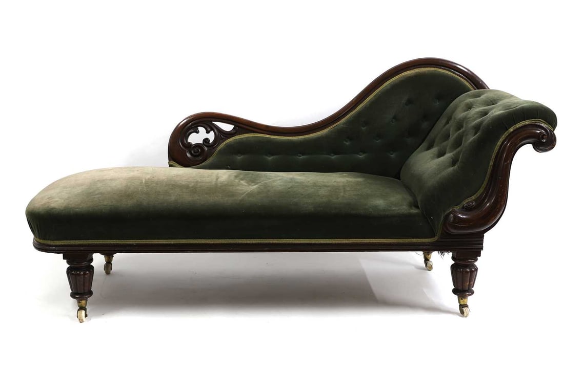 A Victorian mahogany chaise lounge: A Victorian mahogany chaise lounge mid to late 19th century, with shaped back and scroll end, on reeded supports decending onto brass caps and china castors, 162cm wide 66cm deep 89cm high Condition R