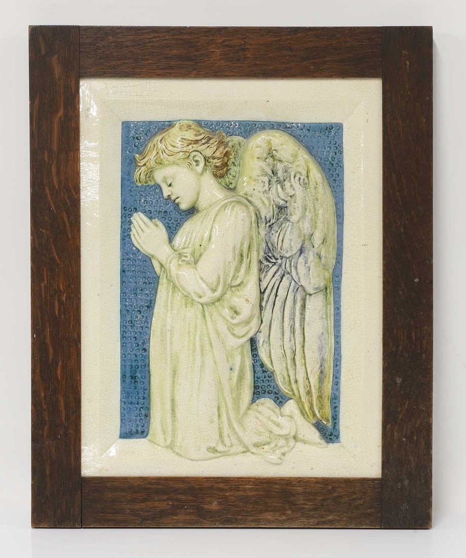 Della Robbia Pottery,: Della Robbia Pottery, a plaque of a praying angel, in low relief with a circle-punched blue background, within a canted 'frame', incised 'DR' and a galleon, numbered '190' and '88' within a circle, 39