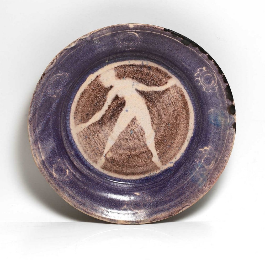 Quentin Bell (1910-1996) for the Fulham Pottery,: Quentin Bell (1910-1996) for the Fulham Pottery, a glazed earthenware bowl, centred with a silhouette of a female, with a rosette-decorated border, signed 'Quentin Bell Fulham Pottery', 23cm diameter