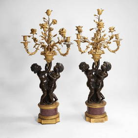 A pair of large gilt-bronze, bronze, and porphyry candelabra after Jean-Louis Prieur, (1 of 15)
