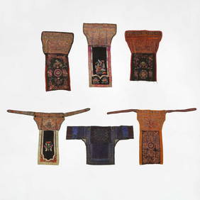 A group of Miao embroidered baby carriers, (1 of 15)