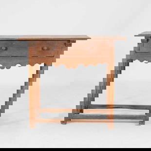 An oak side table,: An oak side table, early 19th century, with a single drawer over a fret-cut apron, the square legs united by stretchers, 86cm wide 52cm deep 75cm high Condition Report: knocks and chips, dents and wea