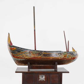 A large painted model of a boat, (1 of 4)