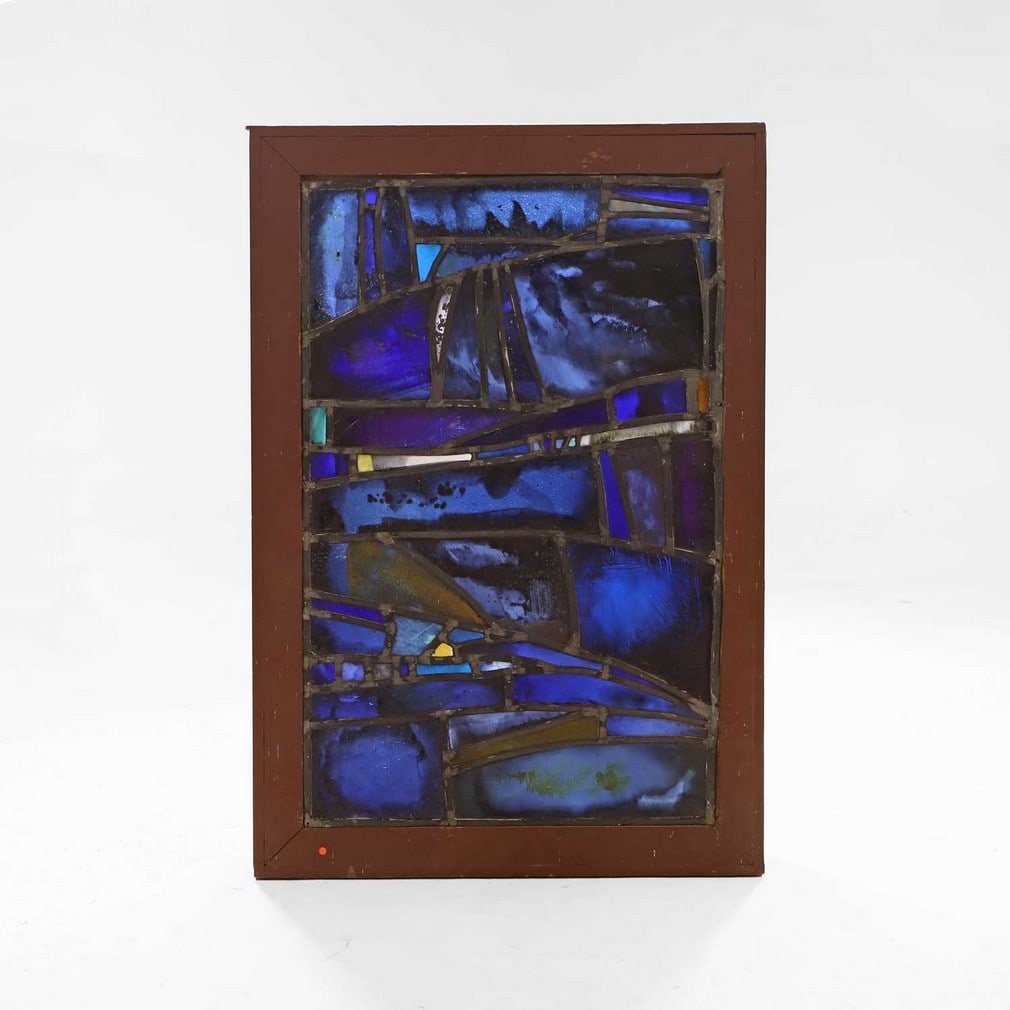 An abstract stained-glass and leaded panel in the manner of John Piper and Patrick Reyntiens,: An abstract stained-glass and leaded panel in the manner of John Piper and Patrick Reyntiens, mid-20th century, predominantly blue, 75 x 47cm Condition Report: in a later display frame, slightly loose