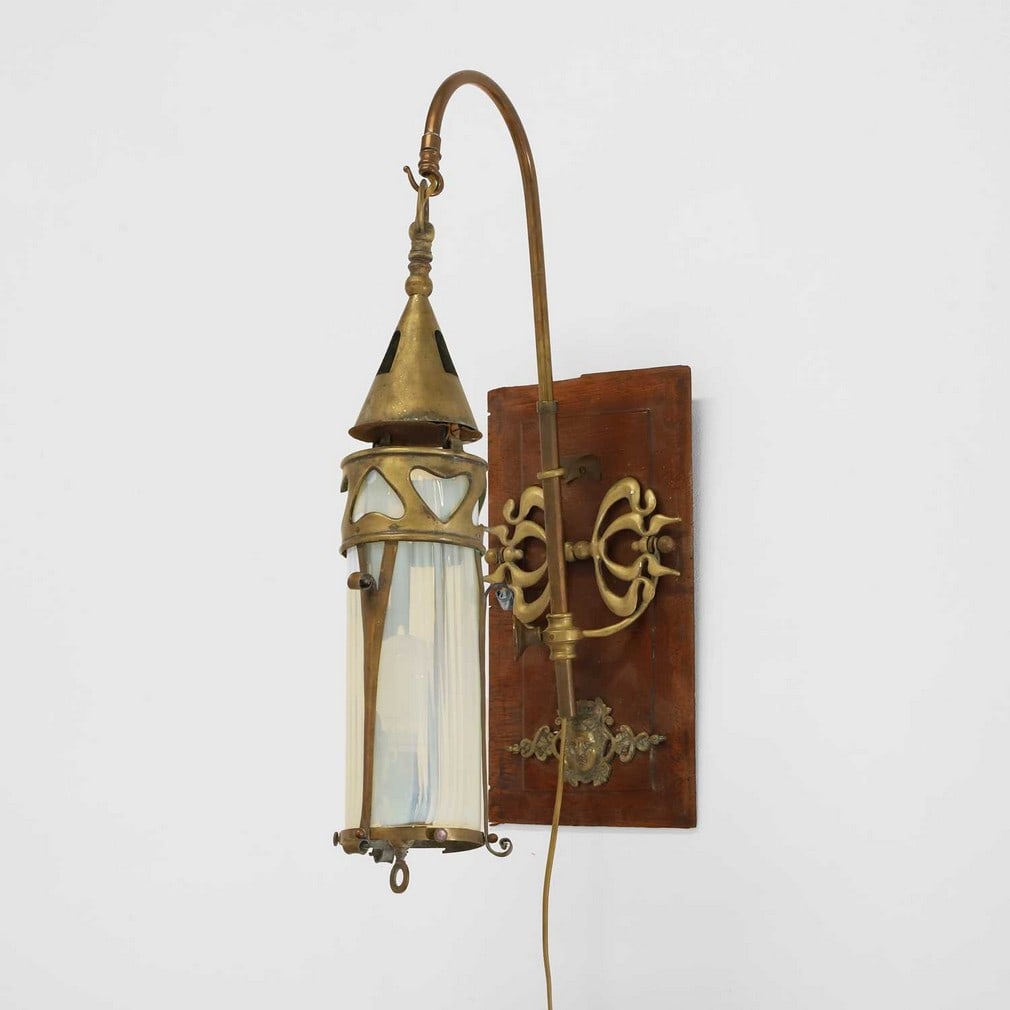 An Art Nouveau brass and opaline glass wall light, (1 of 5)