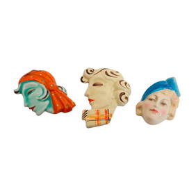 A group of three Art Deco pottery wall masks (1 of 2)