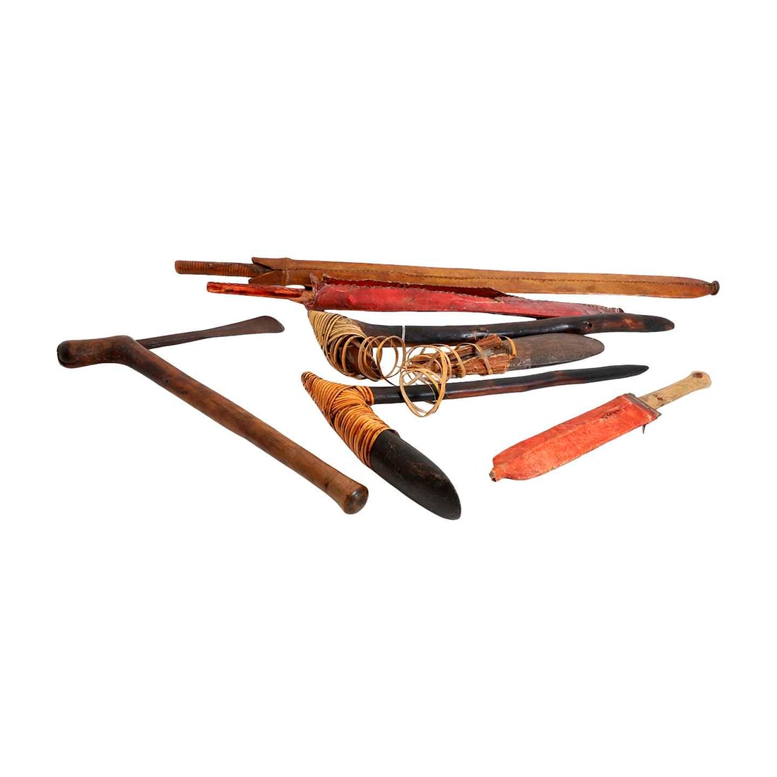 A Papua New Guinea axe: A Papua New Guinea axe the shaped wooden handle with polished stone head bound with rattan binding 46cm high, together with two other Papua New Guinea axes, two Panga machetes and a similar dagger (6)