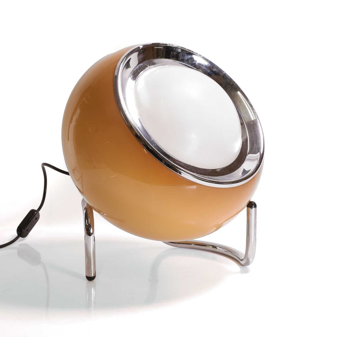 ? Harvey Guzzini (Italian, 1929-2020),: ? Harvey Guzzini (Italian, 1929-2020), a 'Clan' floor lamp, c.1970, with a cognac acrylic curved shade, raised on a curved tubular chrome stand, 35cm diameter 40cm high Condition Report: There is a cr