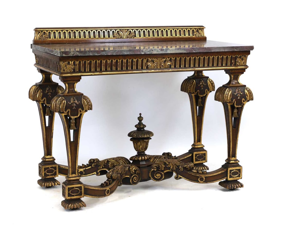 A Louis XIV style parcel gilt walnut console table,: A Louis XIV style parcel gilt walnut console table, 20th century, with marble top over parcel gilt supports united by a stretcher, 107cm wide 54.5cm deep 87.5cm high Condition Report: Top section at t