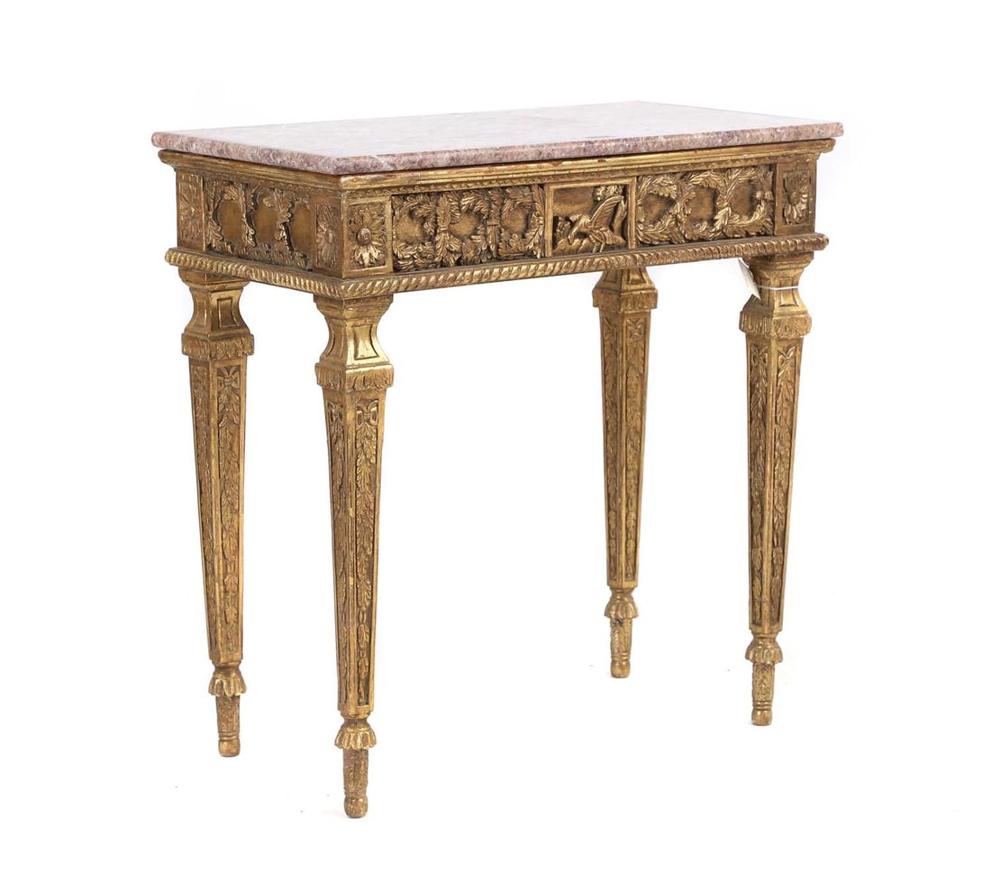 A gilt and marble topped console table,: A gilt and marble topped console table, 20th century, the rectangular top over a relief moulded frieze, 73cm wide 40.2cm deep 75.5cm high Condition Report: General knocks, scuffs, and wear. Losses to
