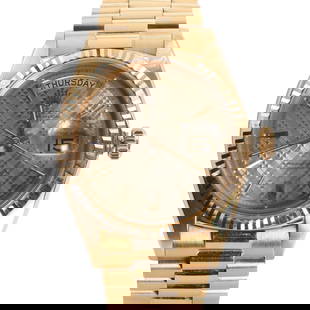 An 18ct rose gold Rolex Day Date automatic bracelet watch,: An 18ct rose gold Rolex Day Date automatic bracelet watch, ref.1803, the circular case, 36mm diameter, with a textured dial, applied gilt batons and gilt hands, magnified date aperture at 3, day apert