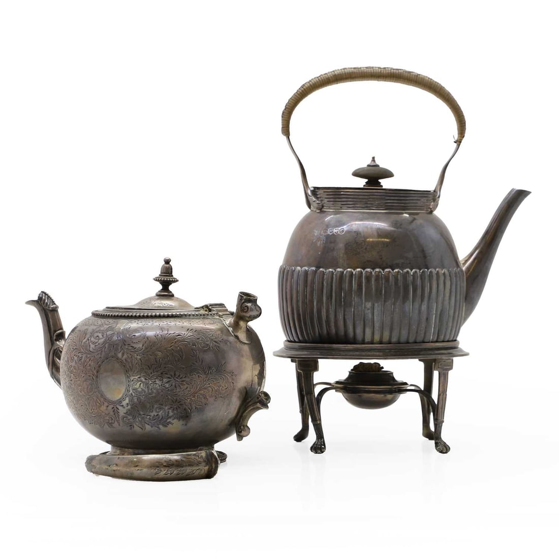 A silver spirit kettle and stand: A silver spirit kettle and stand by Charles Stuart Harris, London 1884, with reeded body, the stand on tapering legs with paw feet, 29cm high together with a teapot, by Arthur Sibley, London 1862, the