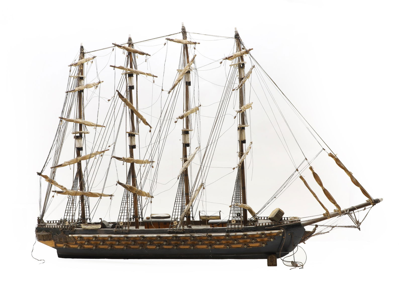 A scratch built wooden model of a four masted man of war,: A scratch built wooden model of a four masted man of war, with rigging and three rows of canons, 20th century 106cm wide 74cm high Condition Report: Largely good, damage and losses to rigging