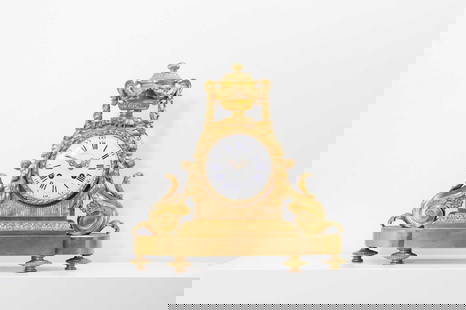 A Louis XVI-style gilt-bronze mantel clock,: A Louis XVI-style gilt-bronze mantel clock, 19th century, French, the case surmounted by an urn draped with fruiting garlands, over an arch applied with acanthus and fruiting scrolls, and raised on a