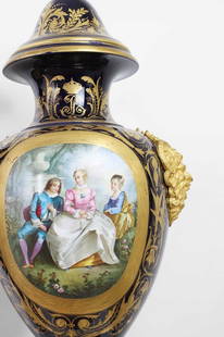 A pair of large S&#232;vres-style porcelain vases and covers,: A pair of large S&#232;vres-style porcelain vases and covers, late 19th/early 20th century, French, each vase of baluster form with twin gilt-metal mask handles and raised on a stand imitating drapery