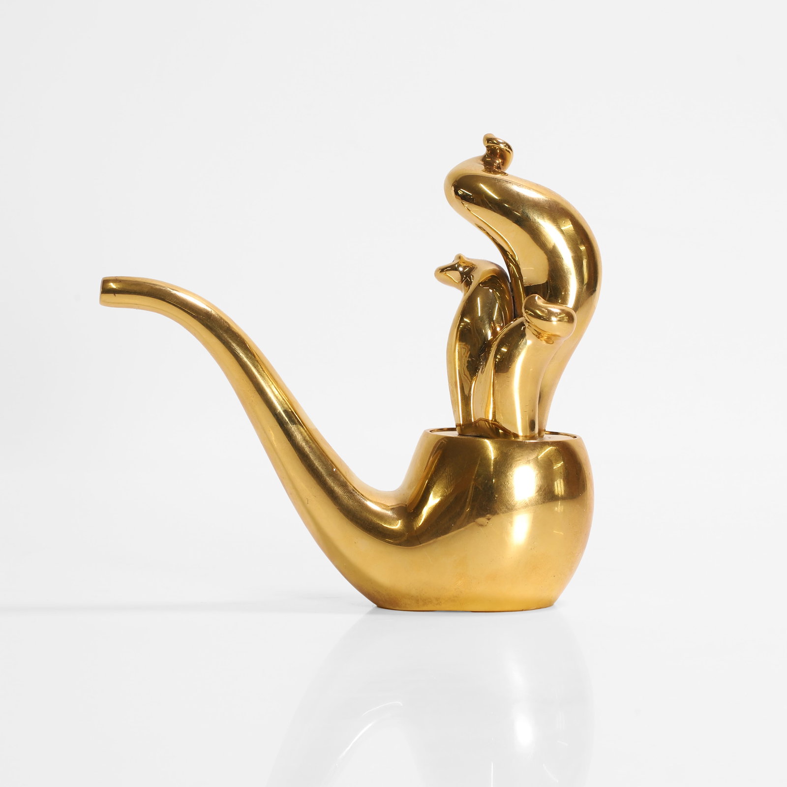 Jonathan Adler (American, b.1966),: Jonathan Adler (American, b.1966), a polished brass pipe, with stamped maker's mark, 15cm high