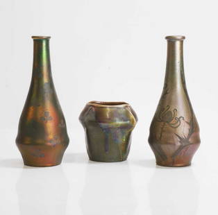 Art Nouveau,: Art Nouveau, a pottery vase, possibly by Tiffany Studios, with a running red lustre over a matt celadon-green glaze, 11cm high, and two Art Nouveau pottery solifleur vases, probably Massier, 23cm high