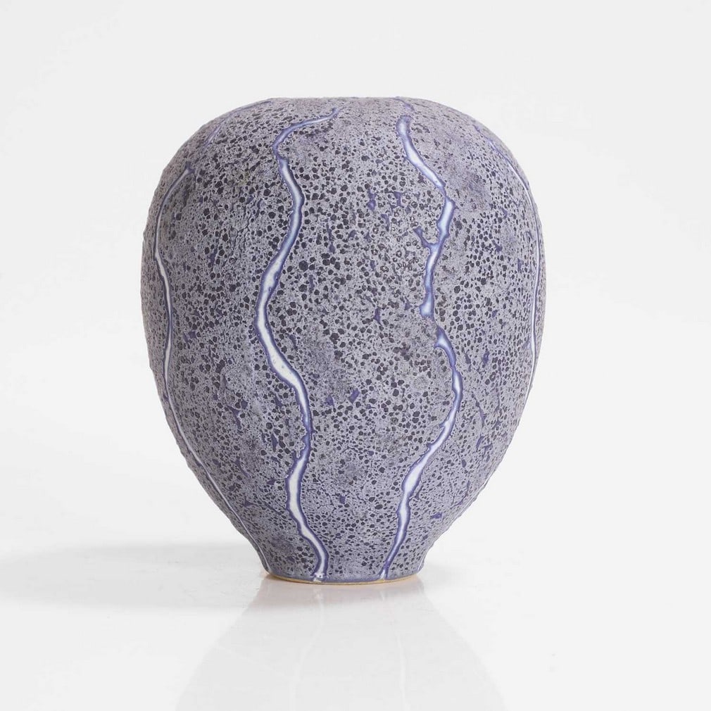 ▲ Peter Beard (b.1951),: ▲ Peter Beard (b.1951), a stoneware vessel, of ovoid form, covered in indigo glaze with incised decoration picked out in white, impressed maker's mark (glaze filled), 12.5cm high Condition Repor