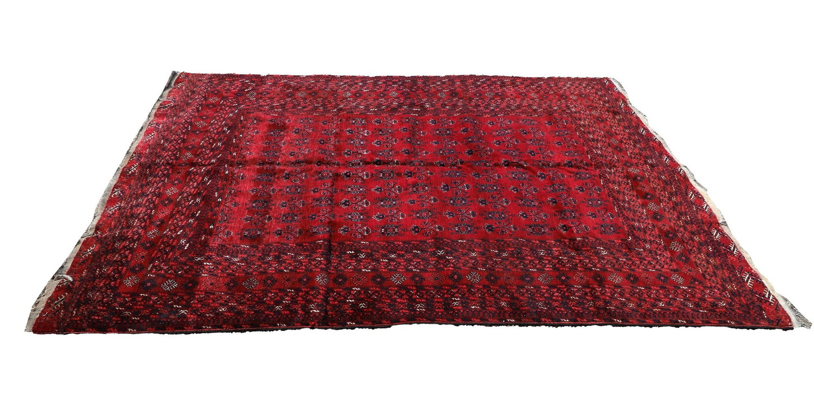 A Turkoman wool rug, (1 of 3)