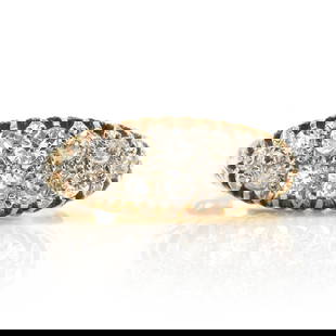 A late Victorian diamond boat shaped ring,: A late Victorian diamond boat shaped ring, with graduated old European cut diamonds bead set in white to pierced gallery sides, to engraved shoulders into a yellow gold plain hoop, marked 18ct, 5.33g