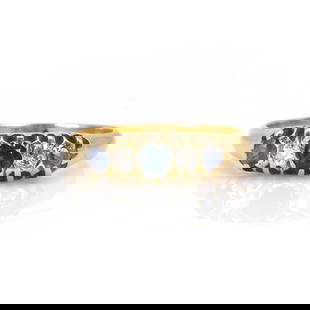 An Edwardian sapphire and diamond ring,: An Edwardian sapphire and diamond ring, with three round mixed cut sapphires spaced with two old cut diamonds, in a belcher setting, to a plain hoop. Unmarked and tested as approximately 18ct gold, 2.