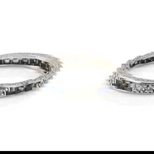 An white gold sapphire and diamond eternity ring,: An white gold sapphire and diamond eternity ring, with channel set square cut sapphires alternating to grain set eight cut diamonds, to hand engraved sides, stamped 834, tested as approximately 18ct g