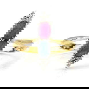 A ruby, sapphire and diamond ring,: A ruby, sapphire and diamond ring, vertically set with an oval cut ruby and sapphire between trefoils of round brilliant cut diamonds, mounted in white gold, to a yellow gold plain band, unmarked and