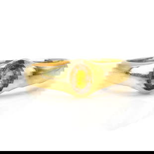 A citrine single stone ring,: A citrine single stone ring, with an oval cut citrine, rub set to hollowed tapered shoulders and a solid 'D' profile shank, stamped 750, tested as approximately 18ct gold, 6.22g Ring size R Buying thi
