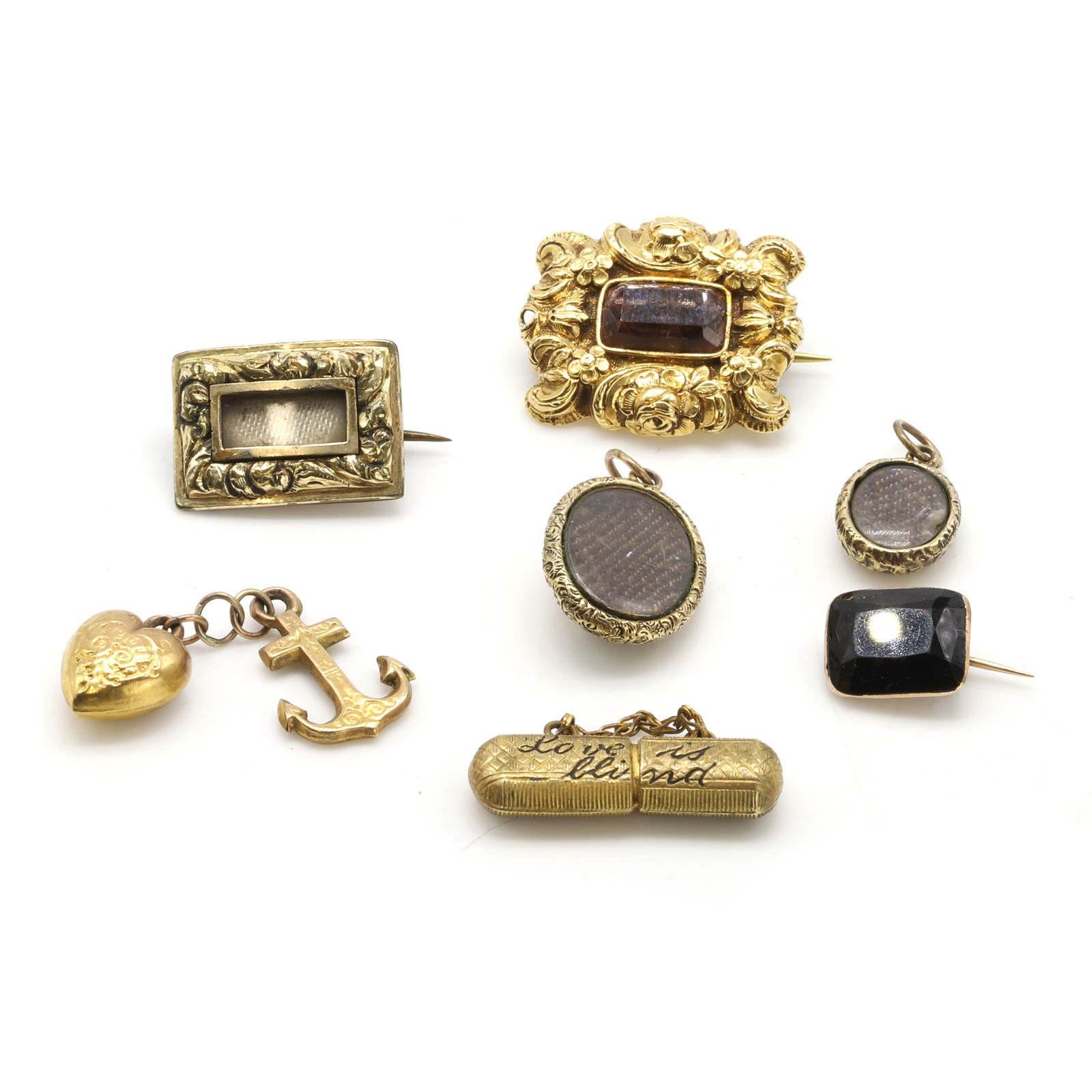 A group of 19th century gold brooches and charms, (1 of 2)