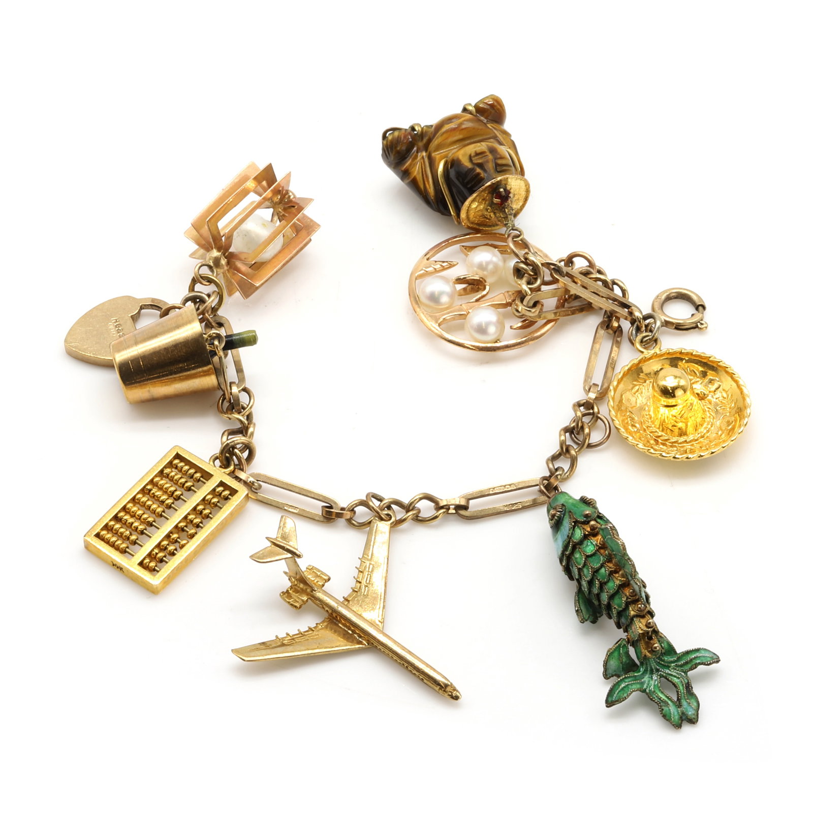 A 9ct gold charm bracelet, (1 of 2)